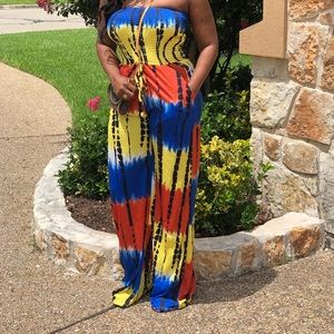 Tube top jumpsuit with pockets and drawstring waist belt.